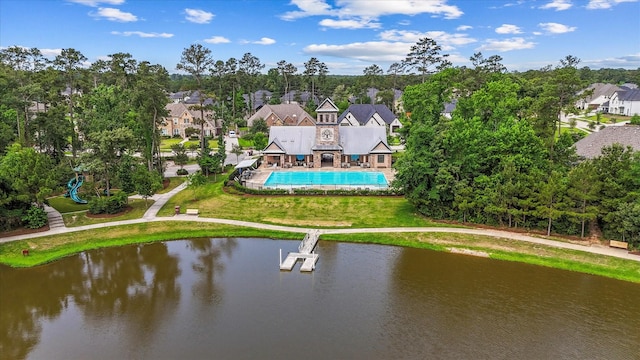 515 Arbor Point Ct, Pinehurst, TX 77362 - aerial view of residential area featuring a nearby body of water, a tree filled landscape, and a pool