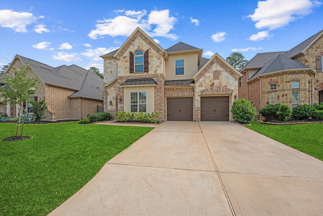 515 Arbor Point Ct, Pinehurst, TX 77362 - french provincial home featuring concrete driveway, a front lawn, a standing seam roof, and stone siding