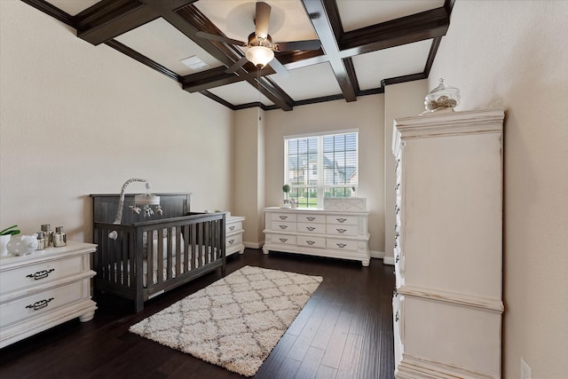 515 Arbor Point Ct, Pinehurst, TX 77362 - bedroom featuring coffered ceiling, beamed ceiling, dark wood finished floors, a ceiling fan, and baseboards