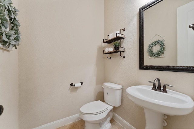 515 Arbor Point Ct, Pinehurst, TX 77362 - half bath with toilet, baseboards, and tile patterned flooring