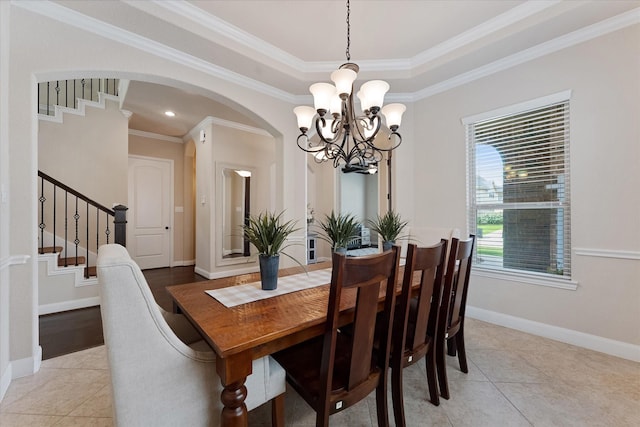 515 Arbor Point Ct, Pinehurst, TX 77362 - dining area with a chandelier, light tile patterned flooring, stairs, arched walkways, and ornamental molding