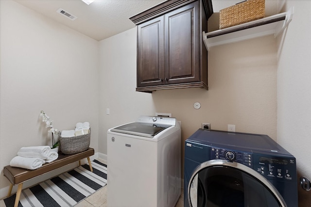 515 Arbor Point Ct, Pinehurst, TX 77362 - washroom featuring cabinet space, independent washer and dryer, and baseboards