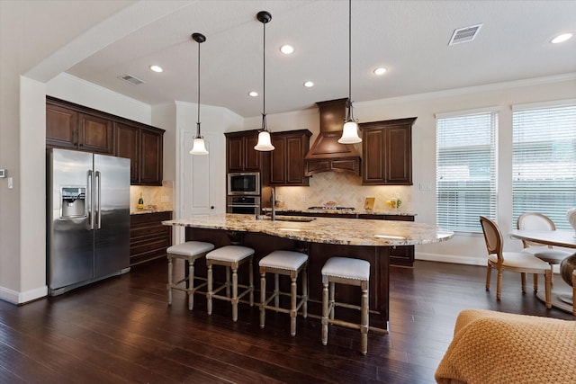515 Arbor Point Ct, Pinehurst, TX 77362 - kitchen with appliances with stainless steel finishes, custom exhaust hood, crown molding, a sink, and dark brown cabinets