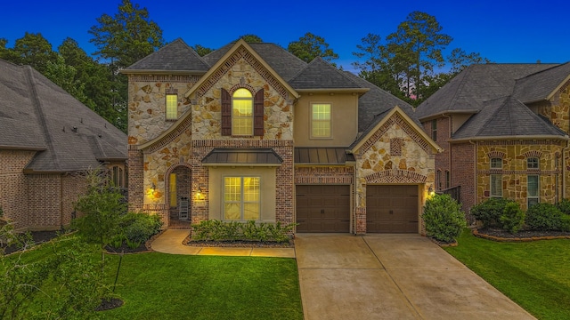 515 Arbor Point Ct, Pinehurst, TX 77362 - french country inspired facade featuring concrete driveway, a front yard, stucco siding, and stone siding