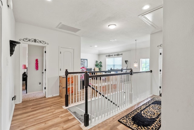 6407 Hillock Ln, Pearland, TX 77584 - hall with attic access, an upstairs landing, light wood-style floors, baseboards, and recessed lighting