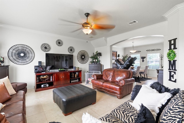 6407 Hillock Ln, Pearland, TX 77584 - living room with arched walkways, crown molding, ceiling fan, light tile patterned floors, and baseboards