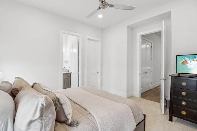 1234 W 21st St, Houston, TX 77008 - bedroom featuring light colored carpet, ensuite bathroom, baseboards, and a ceiling fan