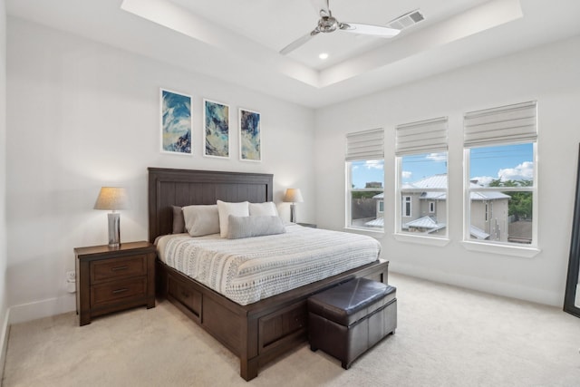 1234 W 21st St, Houston, TX 77008 - bedroom featuring light colored carpet, a raised ceiling, baseboards, ceiling fan, and recessed lighting
