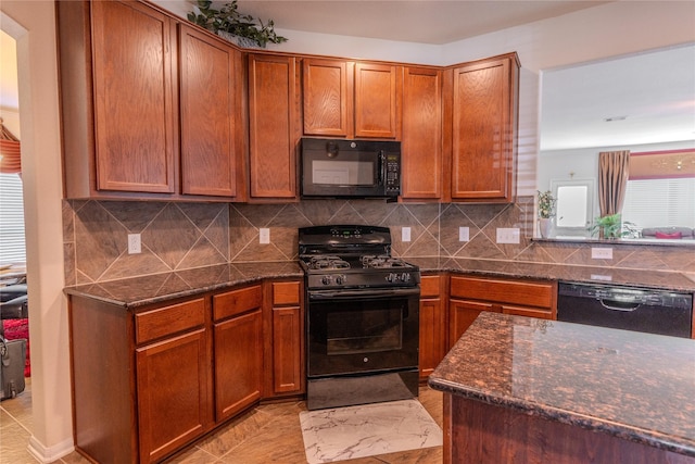 3418 Quarry Place Ln, Katy, TX 77493 - kitchen featuring black appliances, dark stone countertops, and decorative backsplash