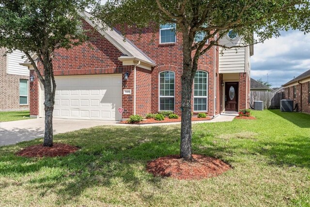 3418 Quarry Place Ln, Katy, TX 77493 - traditional-style home featuring brick siding, a garage, and driveway