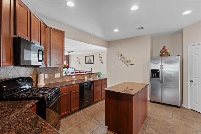 3418 Quarry Place Ln, Katy, TX 77493 - kitchen featuring black appliances, decorative backsplash, brown cabinetry, recessed lighting, and dark stone countertops