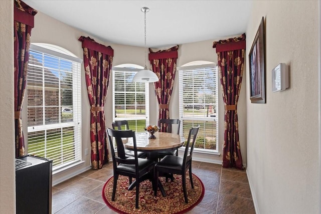 3418 Quarry Place Ln, Katy, TX 77493 - tiled dining space featuring a textured wall