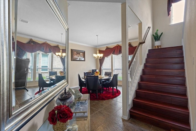 3418 Quarry Place Ln, Katy, TX 77493 - stairway featuring a chandelier, healthy amount of natural light, ornamental molding, and tile patterned flooring