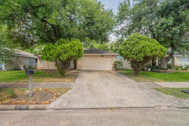 11714 Welshpool Glen Dr, Houston, TX 77066 - obstructed view of property with a front yard and concrete driveway