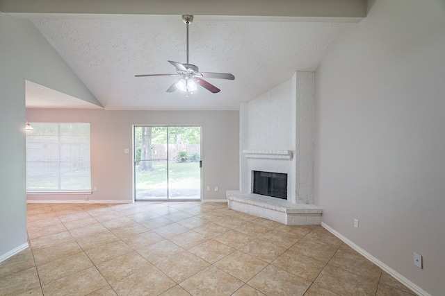 11714 Welshpool Glen Dr, Houston, TX 77066 - unfurnished living room with light tile patterned flooring, lofted ceiling, a textured ceiling, a ceiling fan, and a fireplace