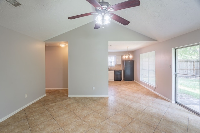 11714 Welshpool Glen Dr, Houston, TX 77066 - unfurnished living room featuring vaulted ceiling, light tile patterned floors, a textured ceiling, ceiling fan, and healthy amount of natural light