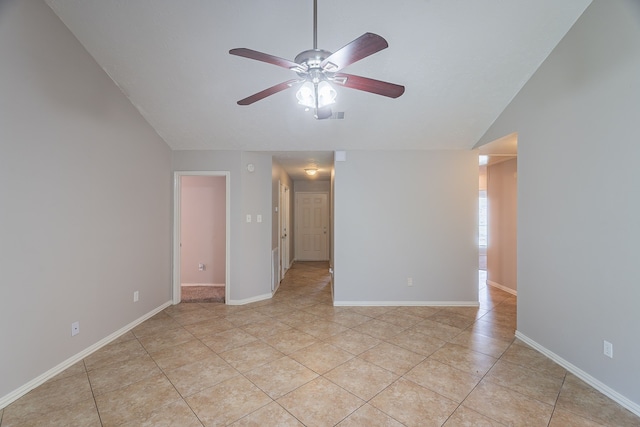 11714 Welshpool Glen Dr, Houston, TX 77066 - empty room with a ceiling fan, light tile patterned floors, lofted ceiling, and baseboards
