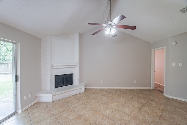 11714 Welshpool Glen Dr, Houston, TX 77066 - unfurnished living room with lofted ceiling, ceiling fan, light tile patterned floors, a brick fireplace, and baseboards