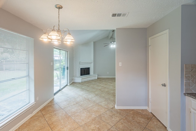 11714 Welshpool Glen Dr, Houston, TX 77066 - unfurnished dining area featuring light tile patterned floors, a fireplace, a ceiling fan, a chandelier, and a textured ceiling