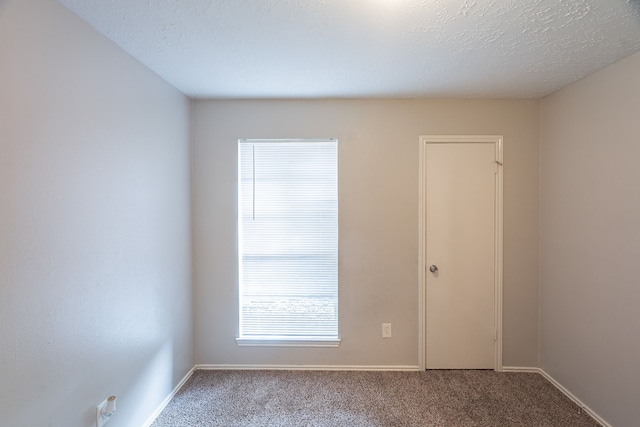 11714 Welshpool Glen Dr, Houston, TX 77066 - carpeted empty room featuring baseboards