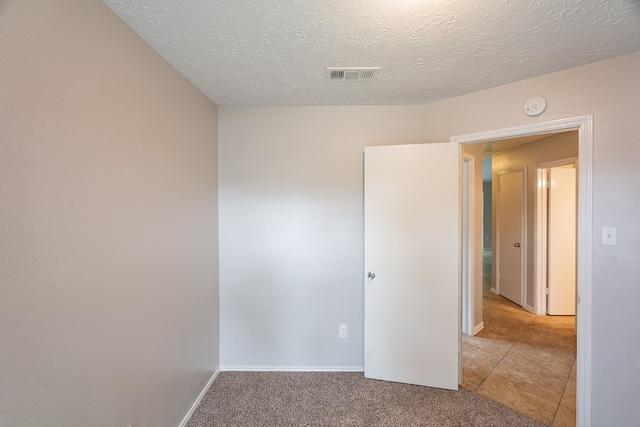 11714 Welshpool Glen Dr, Houston, TX 77066 - carpeted empty room with a smoke detector, a textured ceiling, and baseboards