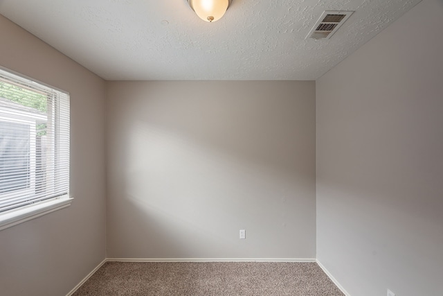 11714 Welshpool Glen Dr, Houston, TX 77066 - carpeted empty room with baseboards and a textured ceiling