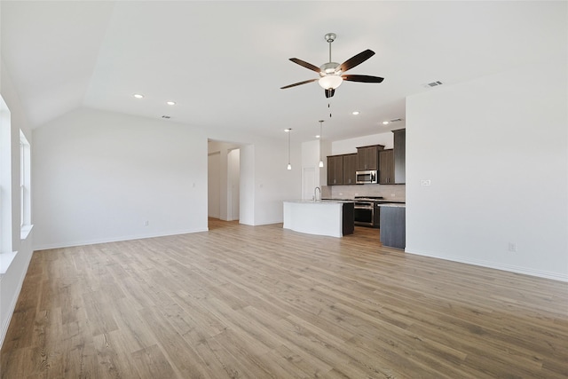 27519 Beachside Arbor Dr, Katy, TX 77493 - unfurnished living room with a ceiling fan, a sink, light wood-style flooring, recessed lighting, and baseboards