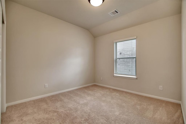418 Kendall Crest Dr, Alvin, TX 77511 - unfurnished room featuring light carpet, lofted ceiling, and baseboards