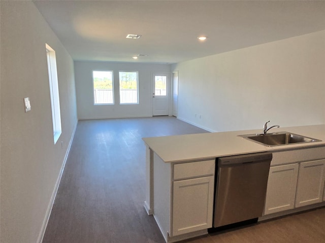 10823 Red Orchid Dr, Houston, TX 77016 - kitchen featuring dishwasher, a sink, baseboards, wood finished floors, and light countertops