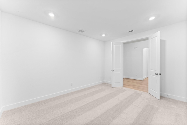 26915 Longwood Ledge Dr, Spring, TX 77389 - spare room featuring light carpet, recessed lighting, and baseboards