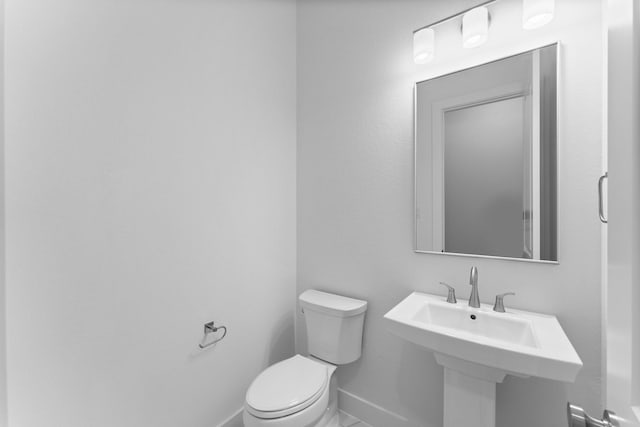26915 Longwood Ledge Dr, Spring, TX 77389 - bathroom featuring toilet and baseboards