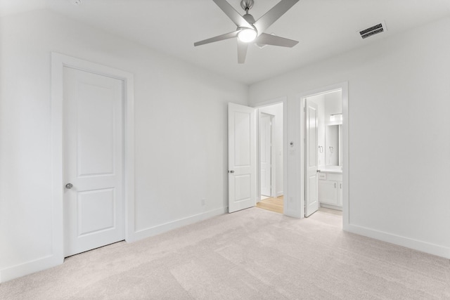 26915 Longwood Ledge Dr, Spring, TX 77389 - unfurnished bedroom with light colored carpet, baseboards, ensuite bathroom, and a ceiling fan