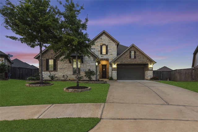 15702 Belmar Heights Dr, Cypress, TX 77429 - french provincial home featuring stone siding, an attached garage, and concrete driveway