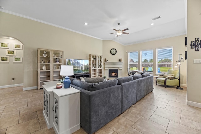 15702 Belmar Heights Dr, Cypress, TX 77429 - living area with a ceiling fan, baseboards, a warm lit fireplace, ornamental molding, and recessed lighting
