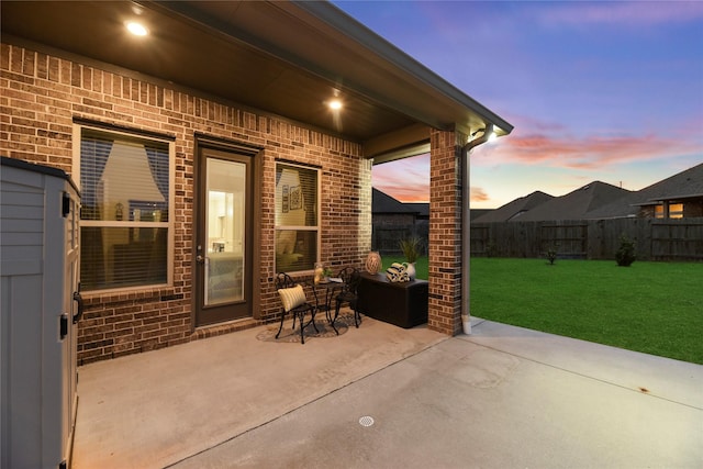 15702 Belmar Heights Dr, Cypress, TX 77429 - patio terrace at dusk with a patio area