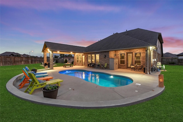 15702 Belmar Heights Dr, Cypress, TX 77429 - pool at dusk with a patio area