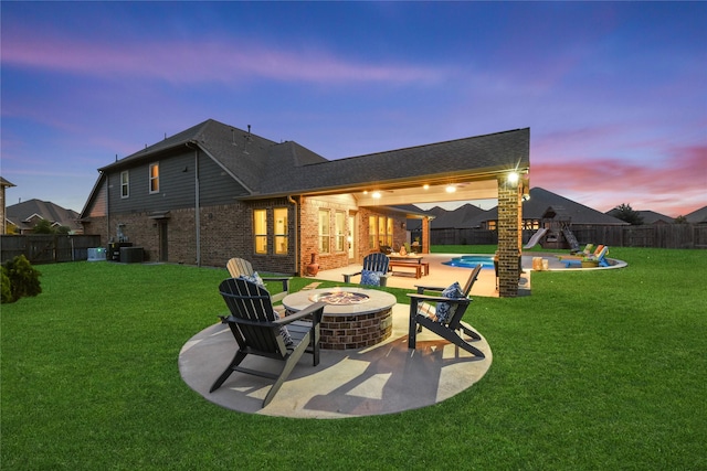 15702 Belmar Heights Dr, Cypress, TX 77429 - rear view of house with a fire pit, a patio area, brick siding, and central AC