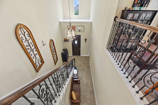 15702 Belmar Heights Dr, Cypress, TX 77429 - staircase featuring a high ceiling, baseboards, and a chandelier