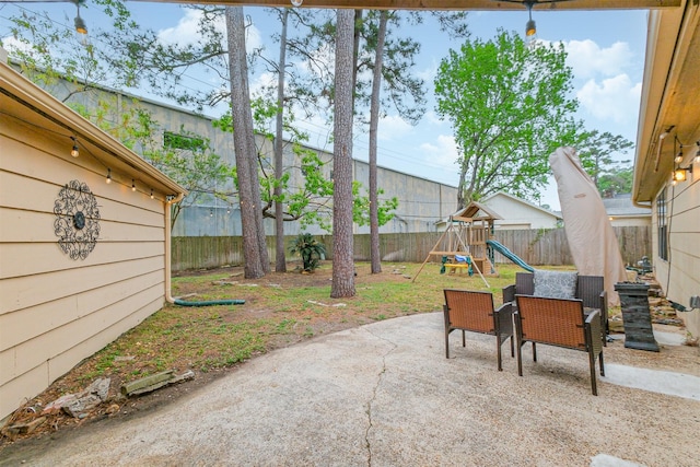 16011 Southampton Dr, Spring, TX 77379 - fenced backyard with a playground and a patio