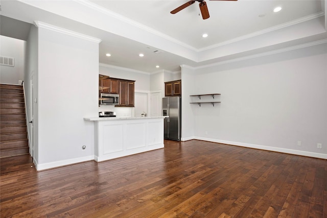 904 W 20th St Unit C, Houston, TX 77008 - unfurnished living room featuring ceiling fan, dark wood-type flooring, stairs, baseboards, and crown molding