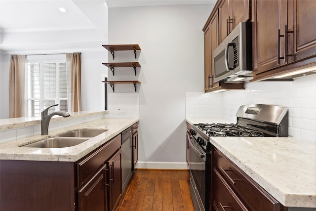 904 W 20th St Unit C, Houston, TX 77008 - kitchen with stainless steel appliances, a sink, baseboards, open shelves, and dark wood-type flooring