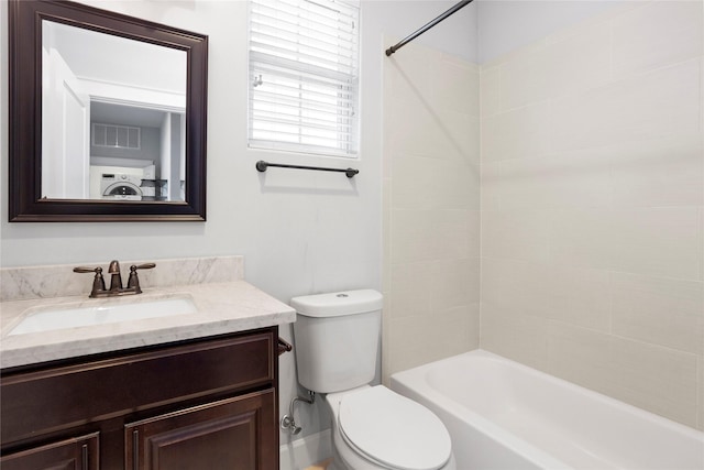 904 W 20th St Unit C, Houston, TX 77008 - full bath with toilet, vanity, washer / clothes dryer, and tub / shower combination