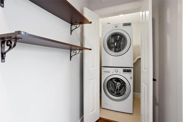 904 W 20th St Unit C, Houston, TX 77008 - laundry area featuring stacked washer / drying machine and tile patterned floors