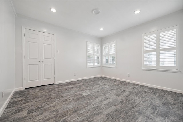 3831 Linklea Dr, Houston, TX 77025 - unfurnished bedroom featuring dark wood finished floors, multiple windows, baseboards, recessed lighting, and crown molding