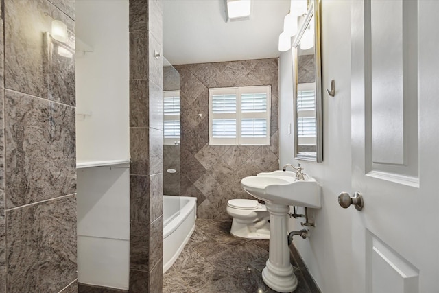 3831 Linklea Dr, Houston, TX 77025 - bathroom featuring toilet, tile walls, and bathing tub / shower combination