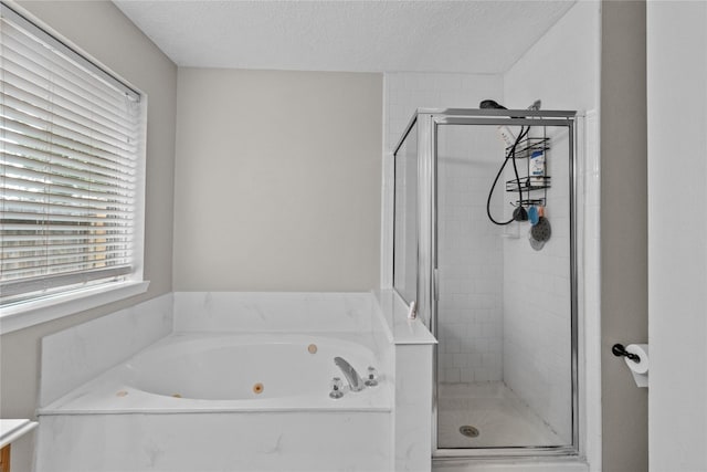 8610 Venture Ln, La Porte, TX 77571 - bathroom featuring a shower stall, a whirlpool tub, and a textured ceiling