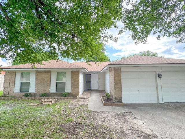 14139 Whispering Palms Dr, Houston, TX 77066 - ranch-style home with an attached garage and driveway