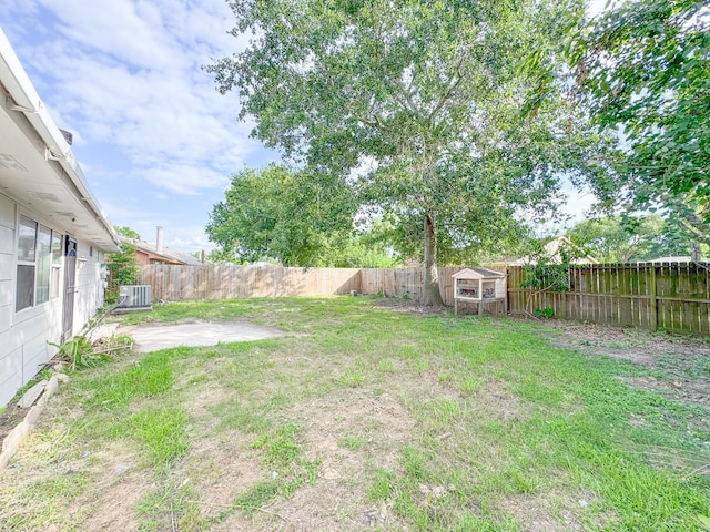 14139 Whispering Palms Dr, Houston, TX 77066 - view of yard featuring central AC, a patio area, and an outdoor structure