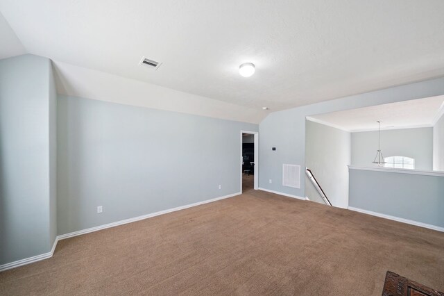 28935 Hidden Cove Dr, Magnolia, TX 77354 - spare room with lofted ceiling, carpet floors, and baseboards