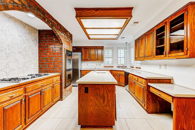 6225 Morton Rd, Katy, TX 77493 - kitchen with a sink, appliances with stainless steel finishes, a center island with sink, and light countertops